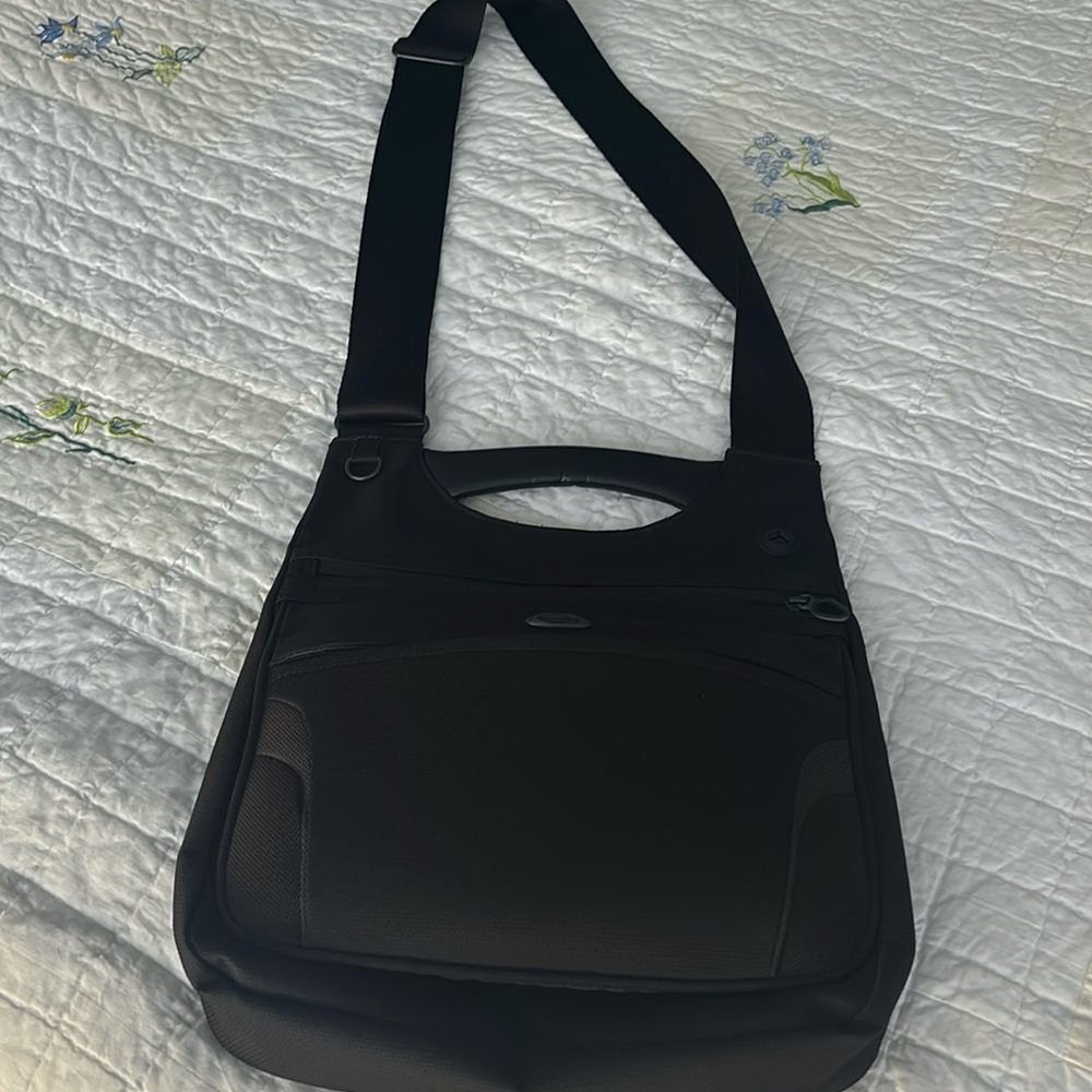 Tumi crossbody travel bag. Like new, used only a few times